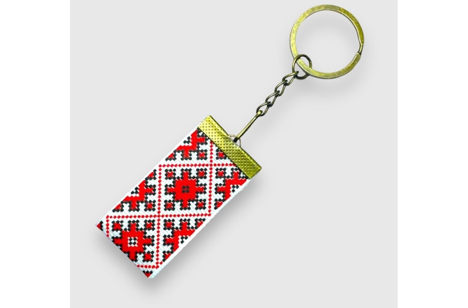 Брелок 25мм червоний орнамент Bronzе